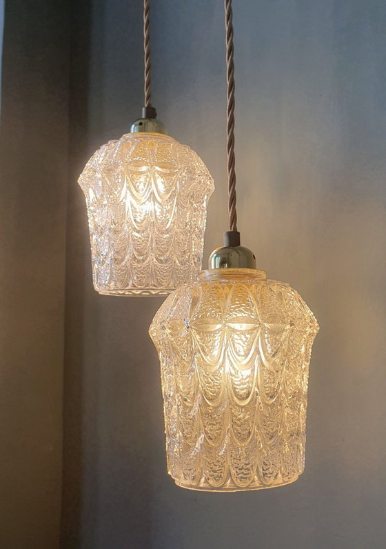 Image 1 of Set of two vintage Mic Century pendant lamps of thick, textured glass.