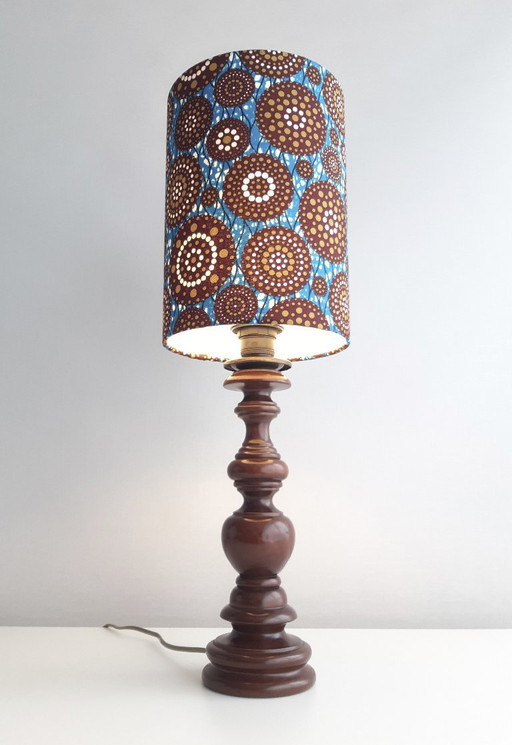 Turned wooden vintage lamp base with handmade lampshade of African wax fabric