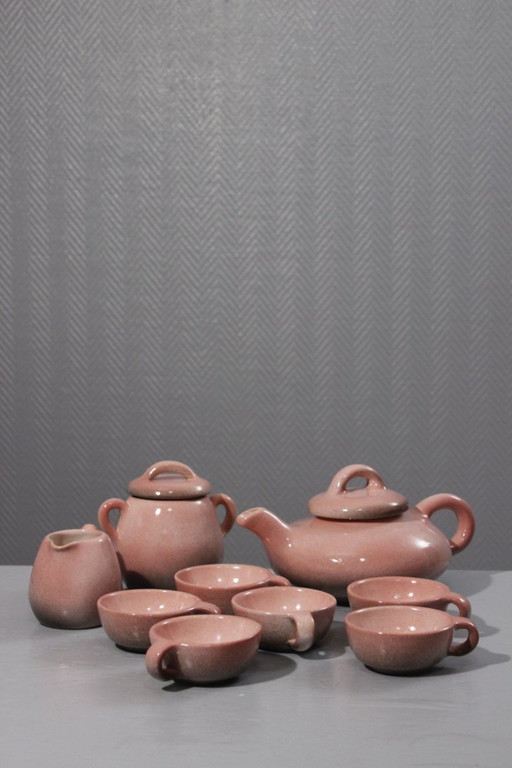 9-piece ceramic coffee service, Max Idlas speckled pink glaze, France, 20th century