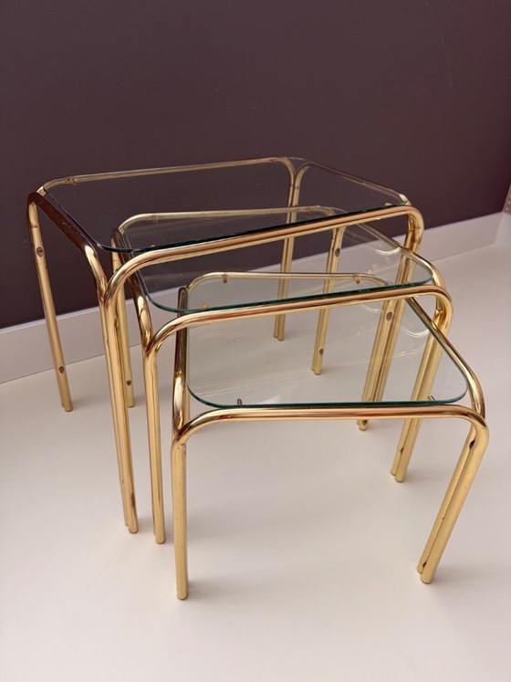 Image 1 of Vintage Mid Century Modern Chrome en glazen bijzettafelset van 3