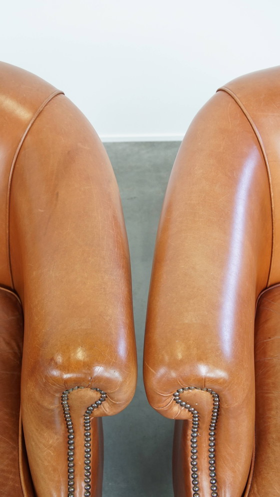 Image 1 of 2 x Cognacfarbener Rindsleder-Clubsessel mit dekorativem Nagelfinish