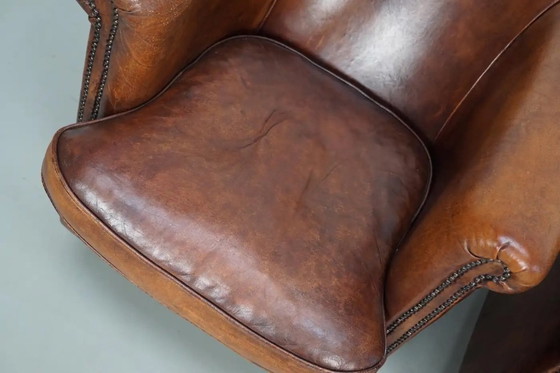 Image 1 of Vintage Nederlandse leren clubfauteuils in cognackleur, set van 2 met voetenbank