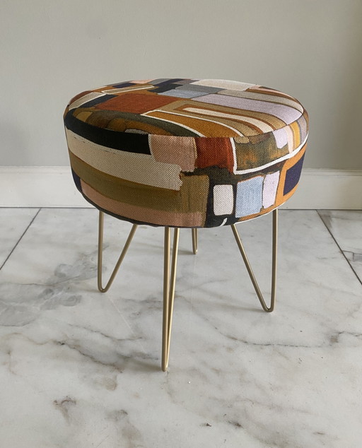 Recycled stool upholstered with designer fabric