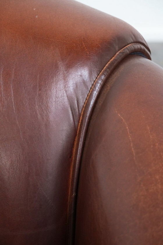 Image 1 of Vintage schapenleren clubfauteuil met siernagels