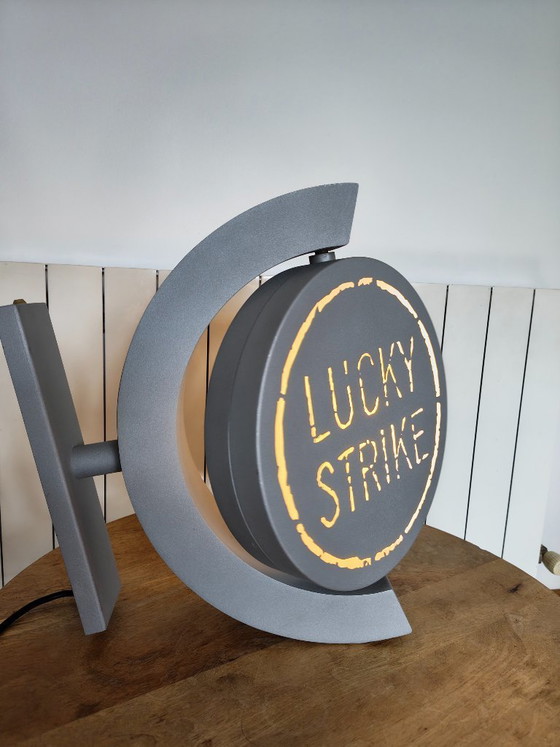 Image 1 of Vintage draaiend lichtreclamebord Lucky Strike