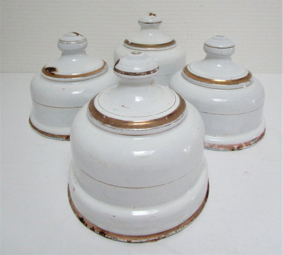 Image 1 of four enameled metal cheese bells, early 20th century