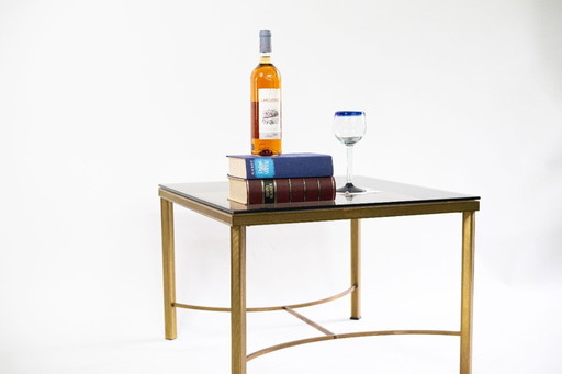 Elegante salontafel met blad van gerookt glas