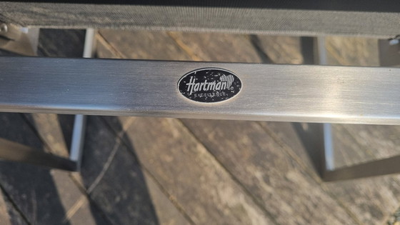 Image 1 of Set da giardino con tavolo in teak e 4 sedie in acciaio inox, realizzato in teak e textilene.