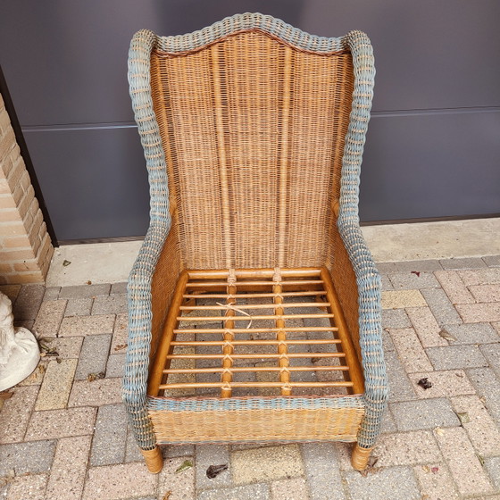 Image 1 of Poltrona lounge e poggiapiedi in rattan in stile French Grange.