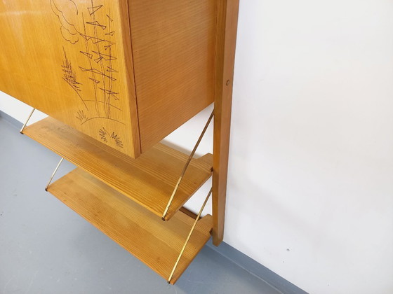 Image 1 of Wall-mounted bookcase with vintage light wood and brass secretary bar, dating from the 1960s