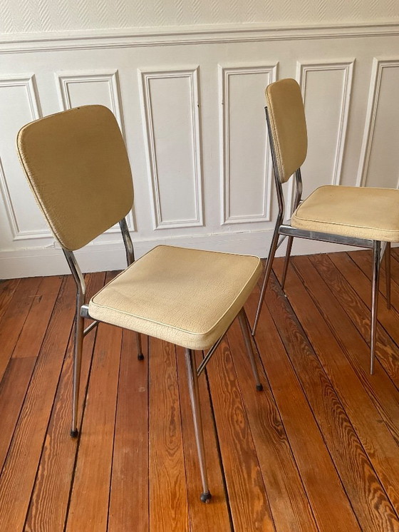 Image 1 of Een paar vintage stoelen uit de jaren 50 - gestempeld - verchroomd staal en gepatineerd kunstleer.