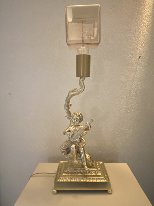Bronze table lamp depicting a cherub playing the guitar
