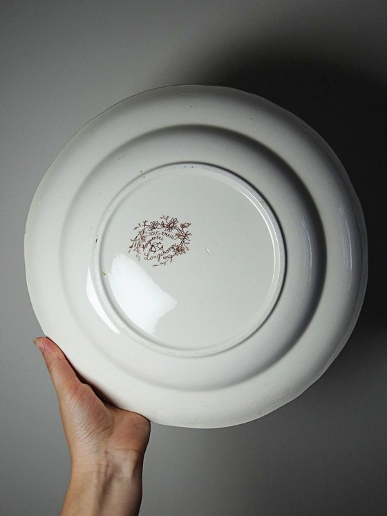 Image 1 of Antique Longchamp deep dish with polychrome ironstone daisies