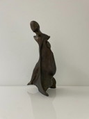Expressive sculpture figure in the wind - futuristic