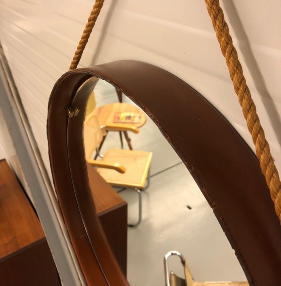 Image 1 of https://www.1stdibs.com/furniture/mirrors/wall-mirrors/pizzetti-cognac-leather-mirror-1950s-italy/id-f_33697732/