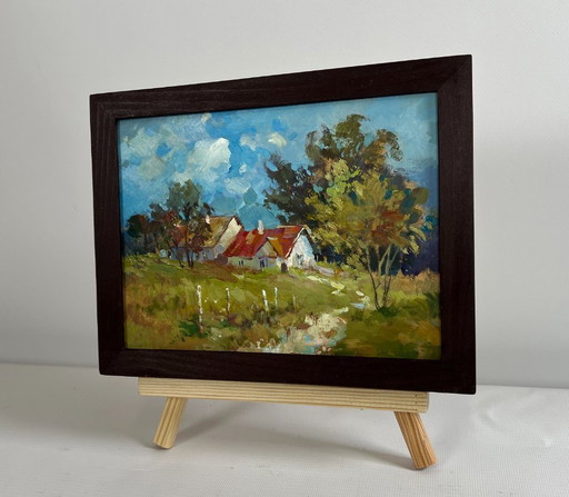 Origineel olieverfschilderij: Zomerdorplandschap met huizen in het bos.