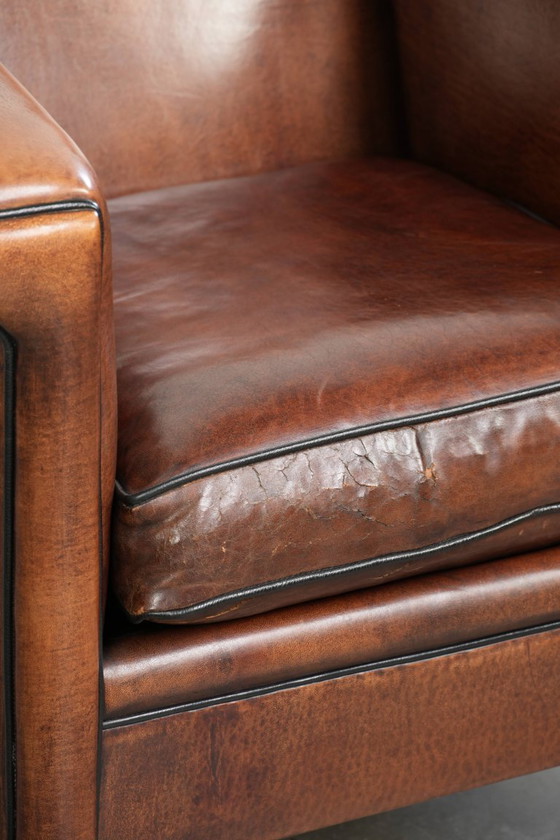 Image 1 of Sheepskin Art Deco design armchair with black piping