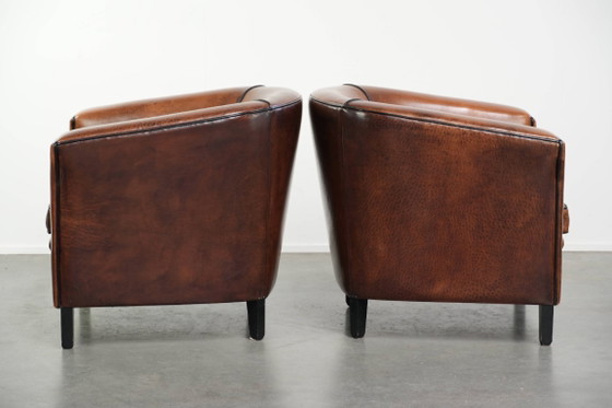 Image 1 of 2x schapenleren Art Deco design clubfauteuil met een mooi patina, zwarte biezen en mooie kleuren