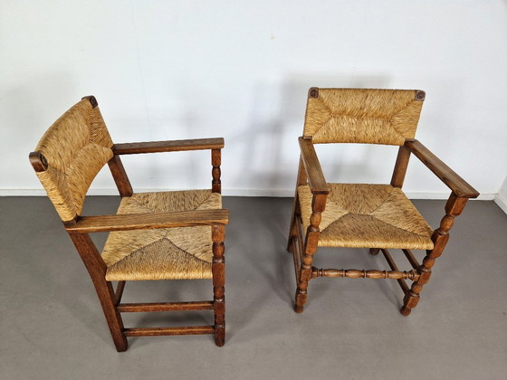 Image 1 of Vintage Franse Armleuningstoelen | Eiken en Riet