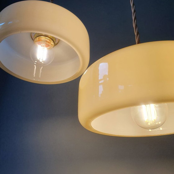 Image 1 of Vintage pendant lamp set (2) of yellow pastel opaline glass. Art Deco design.