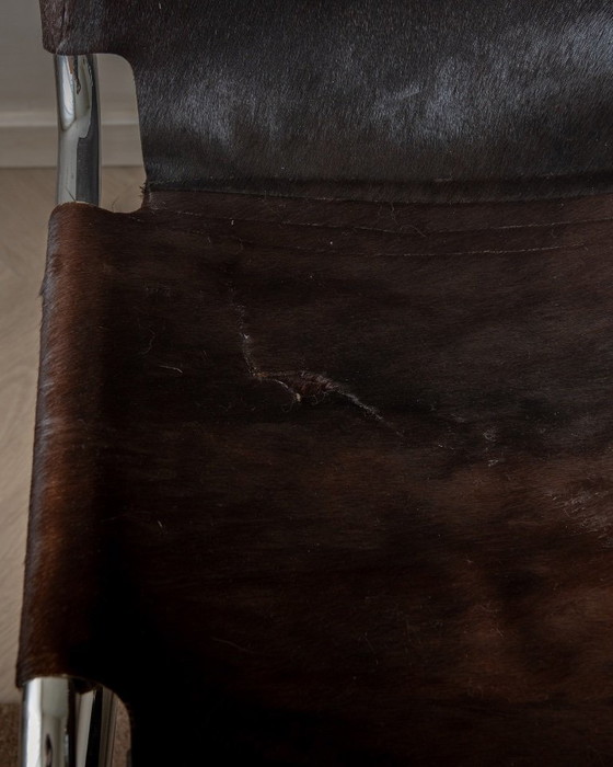 Sillas de comedor cantilever italianas de cromo y piel de vaca, años 70, juego de 4 – Leather (photo 17 of 18)