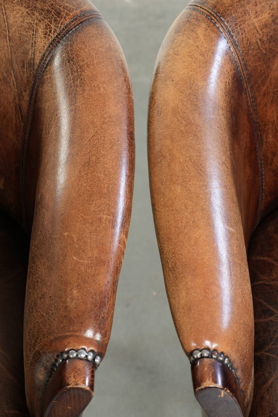 Image 1 of 2x handige schapenleren bijzetstoel/ fauteuil/tubchair met karakter en een mooi patina