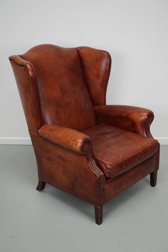 Image 1 of Vintage Nederlandse cognackleurige leren clubfauteuil met vleugelrug