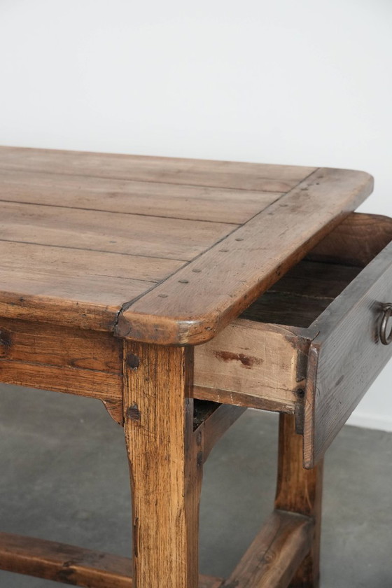 Image 1 of Robust antique French 6-person dining table made of fruit wood with 3 drawers from the late 18th century