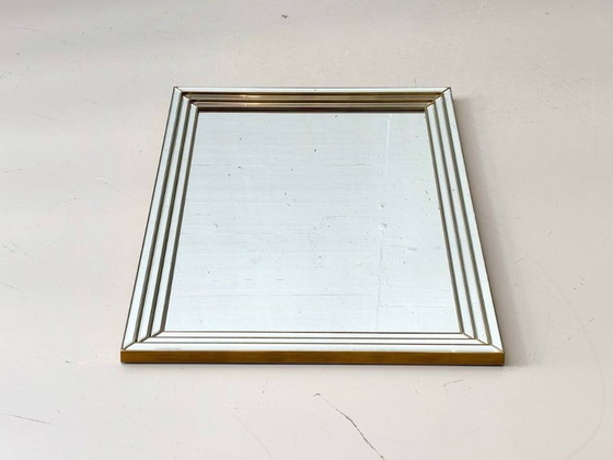 Image 1 of Wall mirror in a frame encased in beveled mirror glass