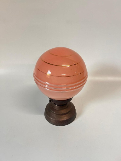 Zacht roze plafonnière met gouden cirkels koperen armatuur