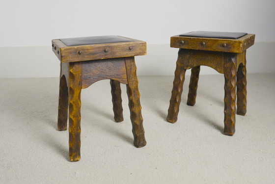 Image 1 of Rustic Oak Stools, 1940s French Hand-Carved Farmhouse Milking Stools, Fireplace Chalet Mountain Decor with Studded Leather Seats