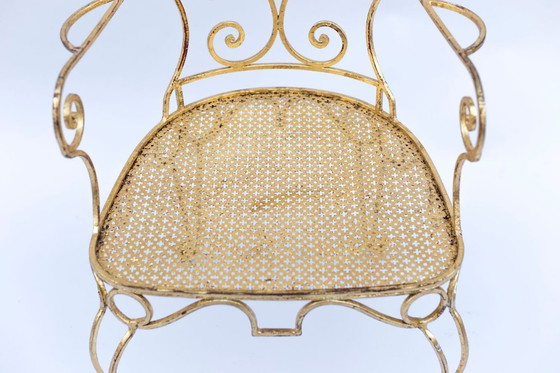 Image 1 of Par de sillones de hierro forjado y dorado, circa 1990.