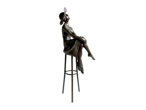 Elegant bronze sculpture woman with hat