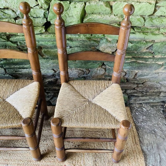 Image 1 of Set van 4 massief houten stoelen met rieten zittingen