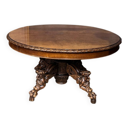 Grande table à manger extensible de style chasse, ornée de quatre figurines de renards sur un pied. – eettafels