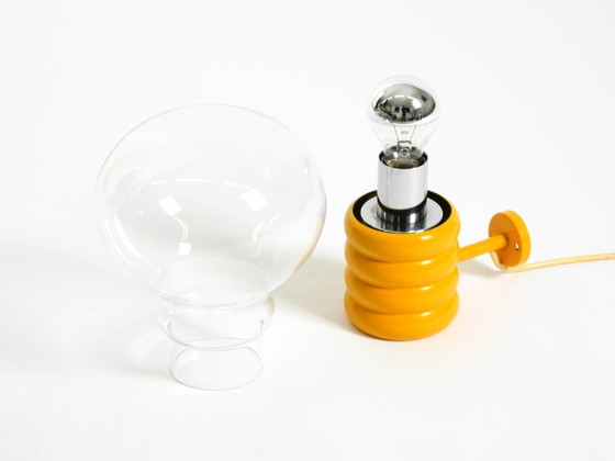 Image 1 of Very rare original 1960s Space Age "Bulb" wall lamp by Ingo Maurer in yellow with a clear glass shade