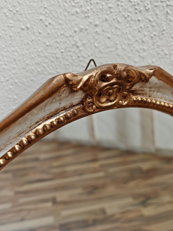 Image 1 of Oval mirror with wooden frame, white, gold from an estate