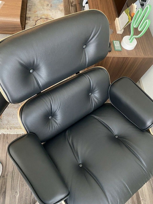 Poltrona e poggiapiedi Herman Miller Eames, 100% autentici.