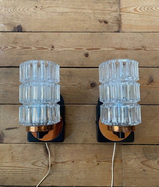 Een paar vintage koperen wandlampen van Phillips uit de jaren 70.