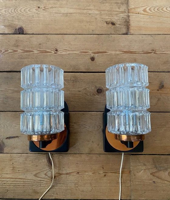 Image 1 of Een paar vintage koperen wandlampen van Phillips uit de jaren 70.