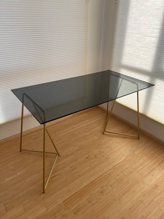Image 1 of MADE  black smokey glass desk with golden metal legs