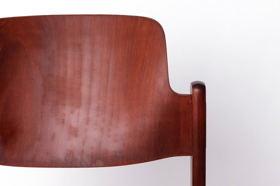 Image 1 of 1 of 9 Sedia impilabile Lübke vintage, design tedesco anni '70, legno di faggio scuro e rivestimento senape