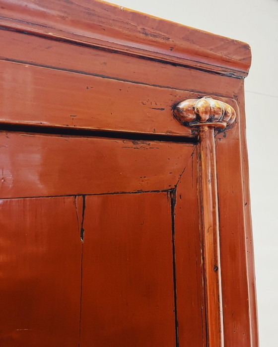 Image 1 of Antique red cabinet with brass details