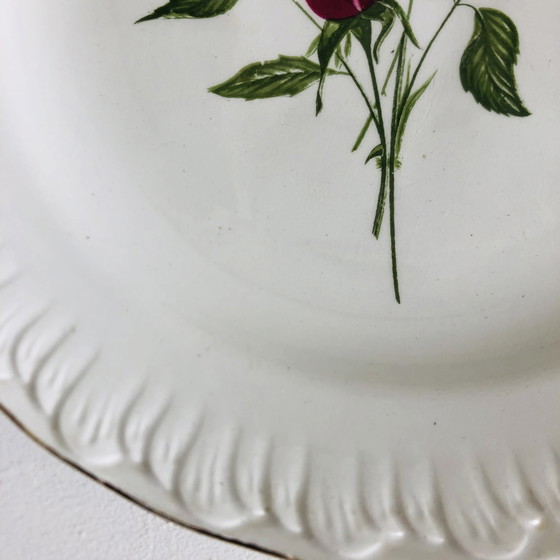 Image 1 of Steingutteller von L'Amandinoise mit einem floralen Art-Deco-Motiv