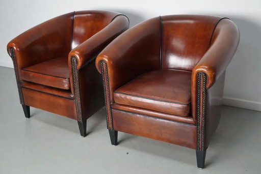 Sillones de club holandeses vintage en cuero color coñac, juego de 2