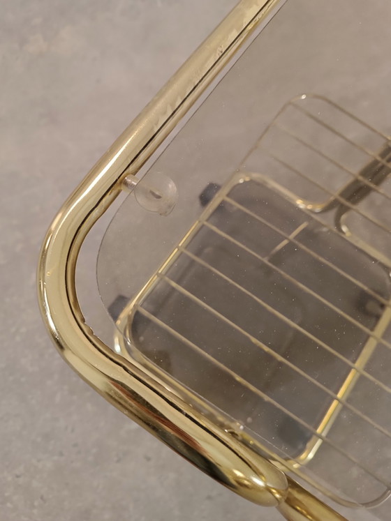 Image 1 of Vintage gold coloured and glass trolley side table 
