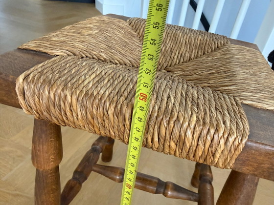 Vintage wooden stool with wicker seat (photo 4 of 5)