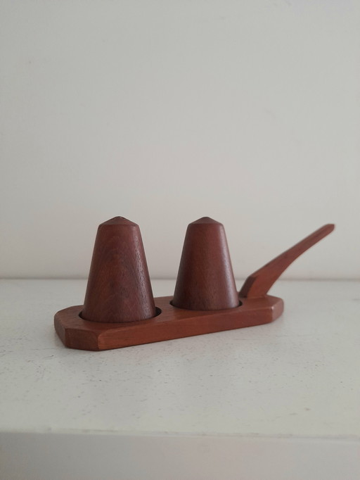 Pepper and salt on teak display stand