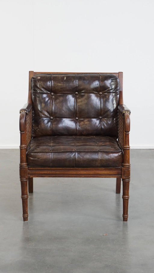 Vintage 1970s designer armchair made of wood, leather and webbing