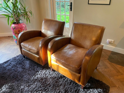 2x vintage brown leather armchairs